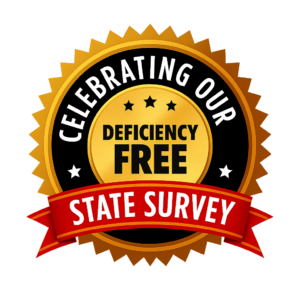 Gold and black badge with a red ribbon that reads "Celebrating Our Deficiency Free State Survey.