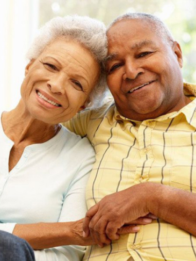 An older couple posing for a Geo photo.